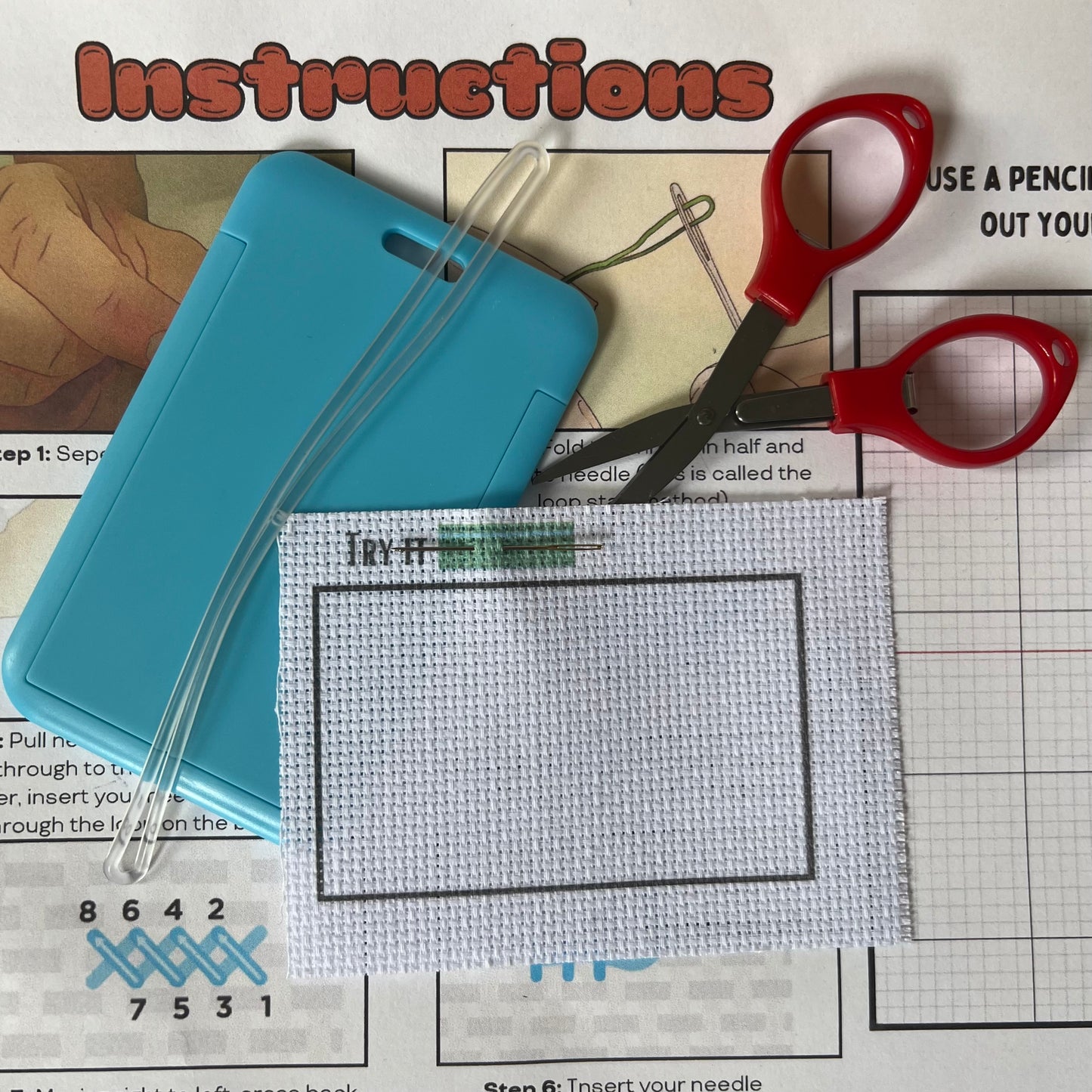 Blank fabric with light blue luggage tag, luggage tag attachment, and travel approved scissors