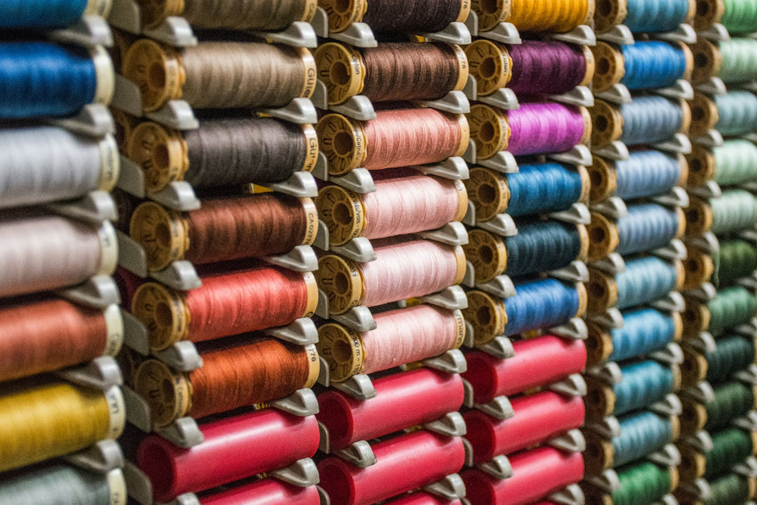 Colorful spools of embroidery thread, ready for a cross stitch Christmas gift project