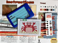Cross-stitching kit with pattern, thread colors, and instructions on a table.