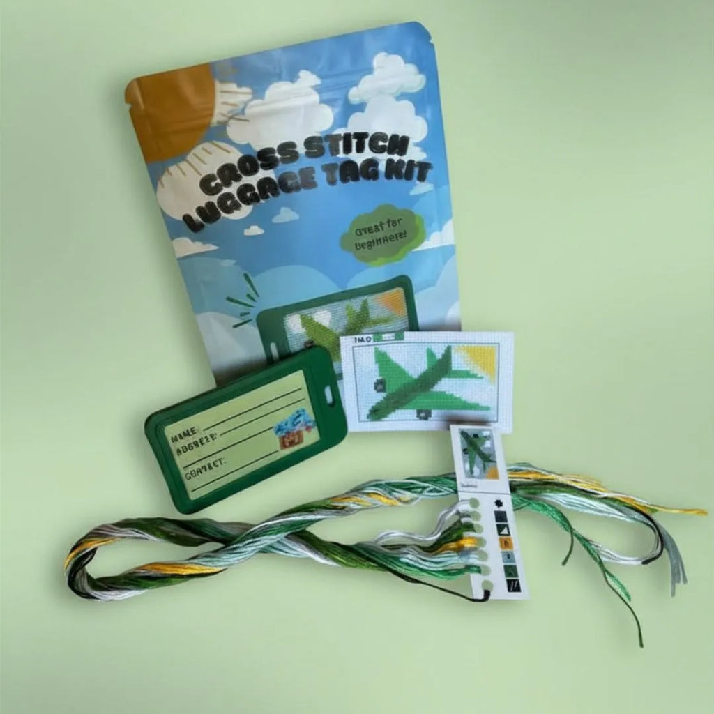 Green Airplane cross stitch luggage tag kit — beginner-friendly stamped fabric and supplies