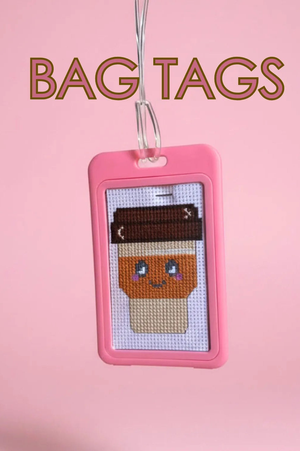 Pink bag tag with a cross-stitched design of a coffee cup on a pink background