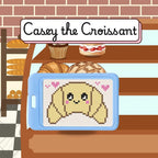 Cross-stitched design of a croissant on a tablet with a bakery background, featuring 'Casey the Croissant'.