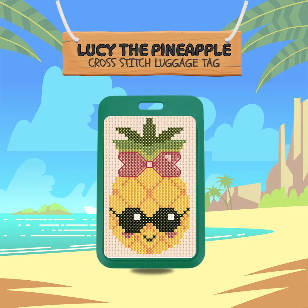 Cross-stitch pineapple luggage tag with sunglasses and a bow, set against a tropical beach background.