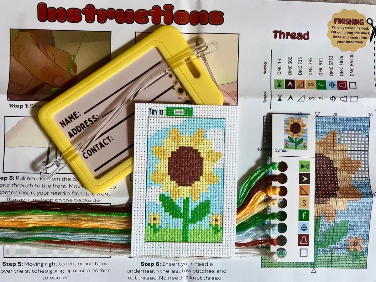 Cross-stitch kit with sunflower design, thread chart, and instruction sheet.