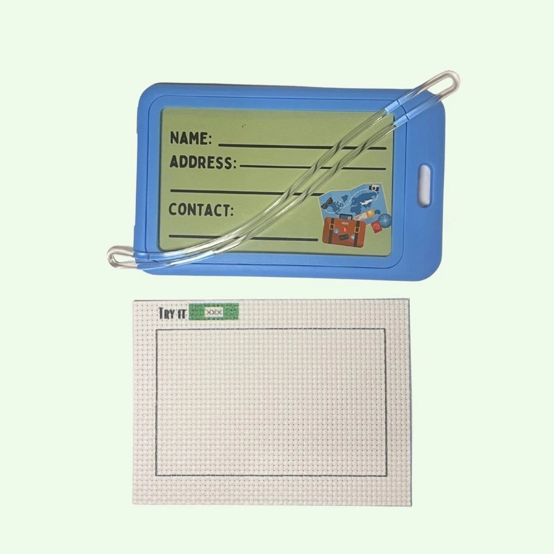 Blue name tag holder with a piece of 14 ct AIDA fabric on a white background